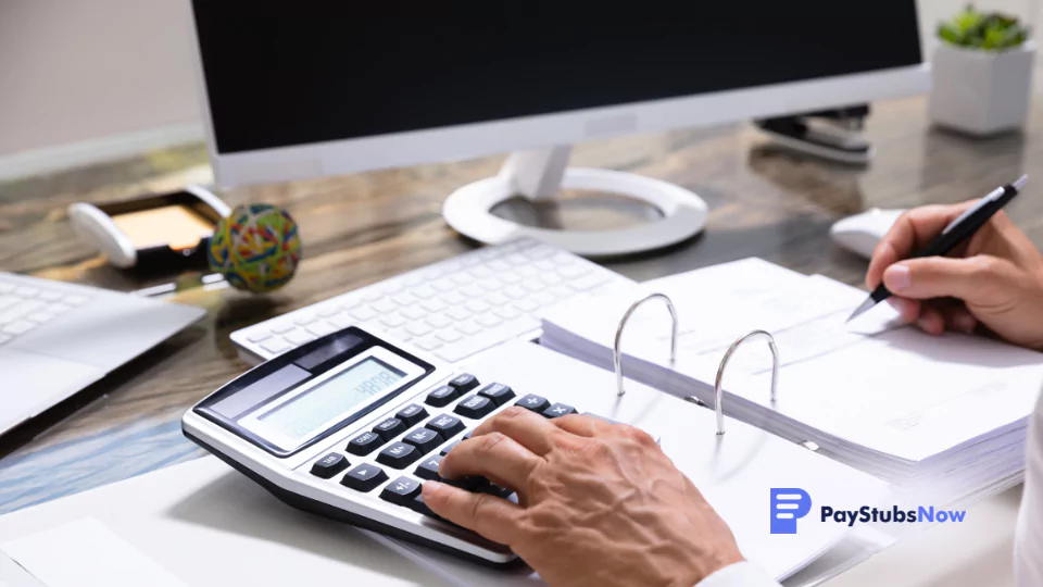 a person using a calculator at their desk